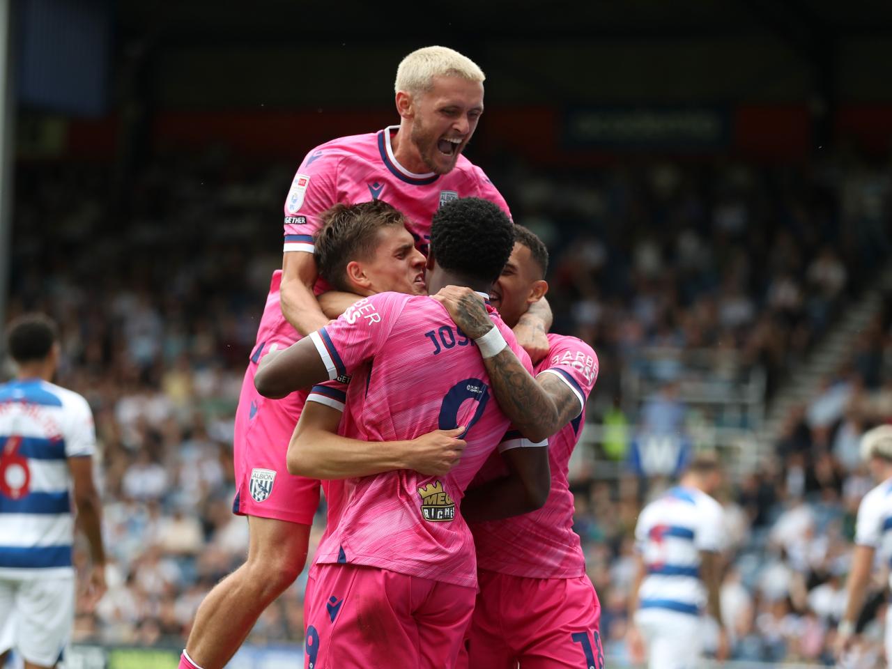 Josh Maja celebrates scoring his second goal at QPR with team-mates