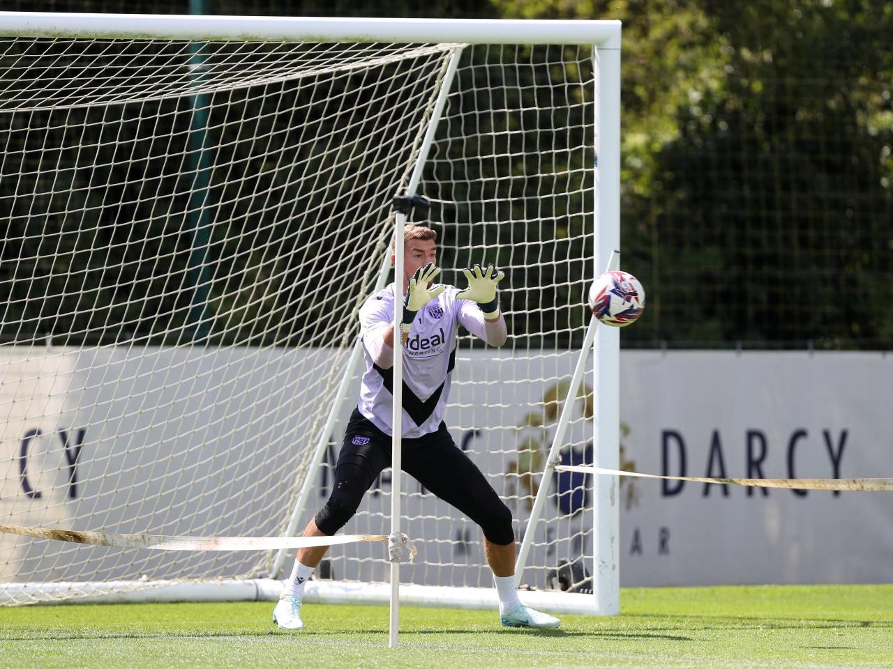 Alex Palmer catching a ball during a training session 