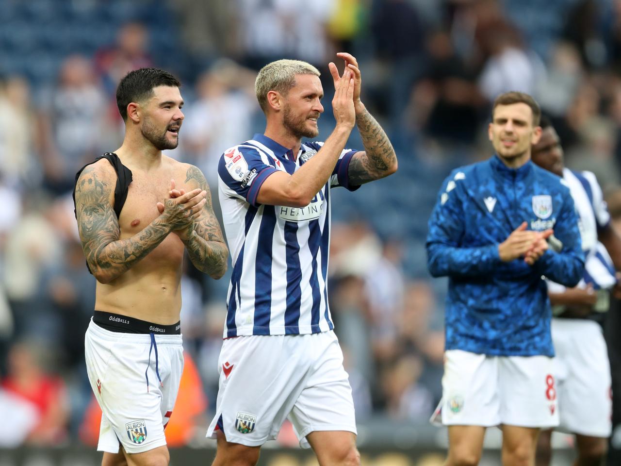 Alex Mowatt and John Swift applauding Albion fans after the game against Swansea 