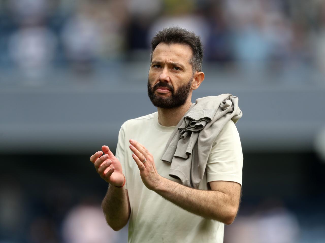 Carlos Corberán applauding Albion fans at QPR 