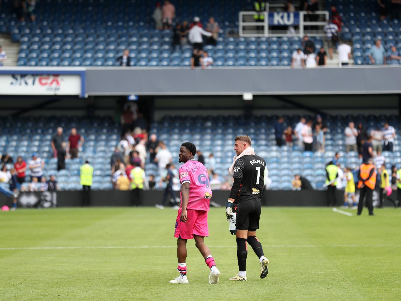 Josh Maja and Alex Palmer walking off the pitch at QPR 