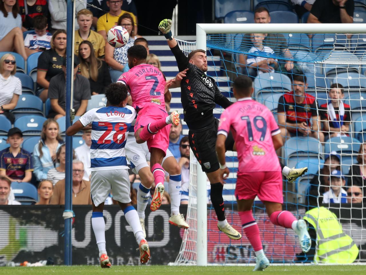 Alex Palmer punching the ball away at QPR 