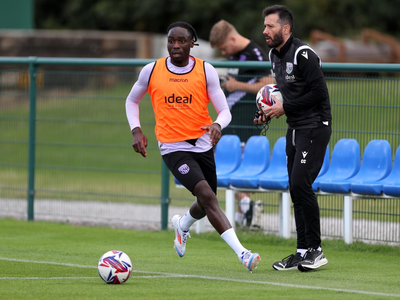 Devante Cole on the ball during training wearing a bib