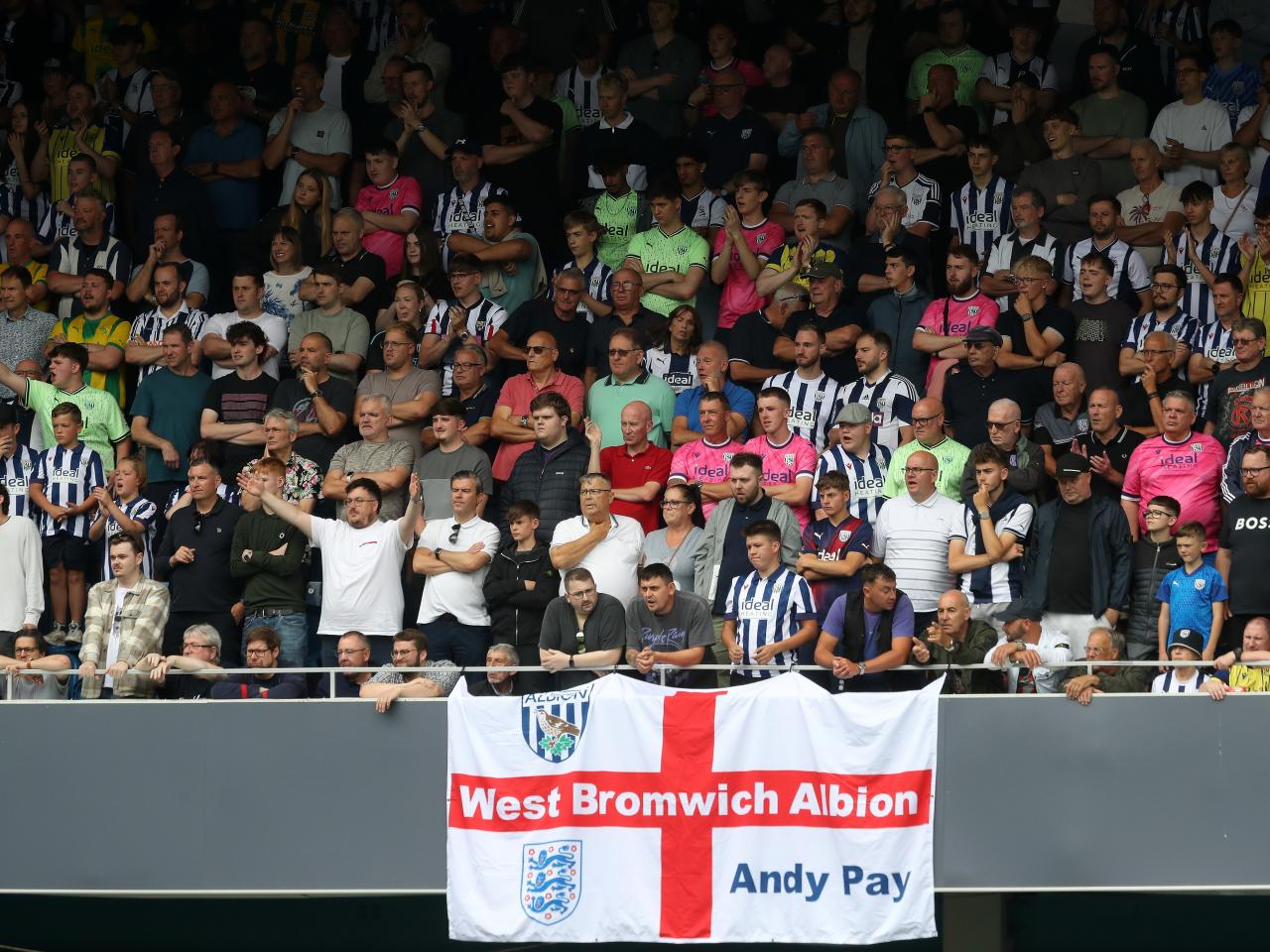 A general view of Albion fans at QPR with a big England flag 