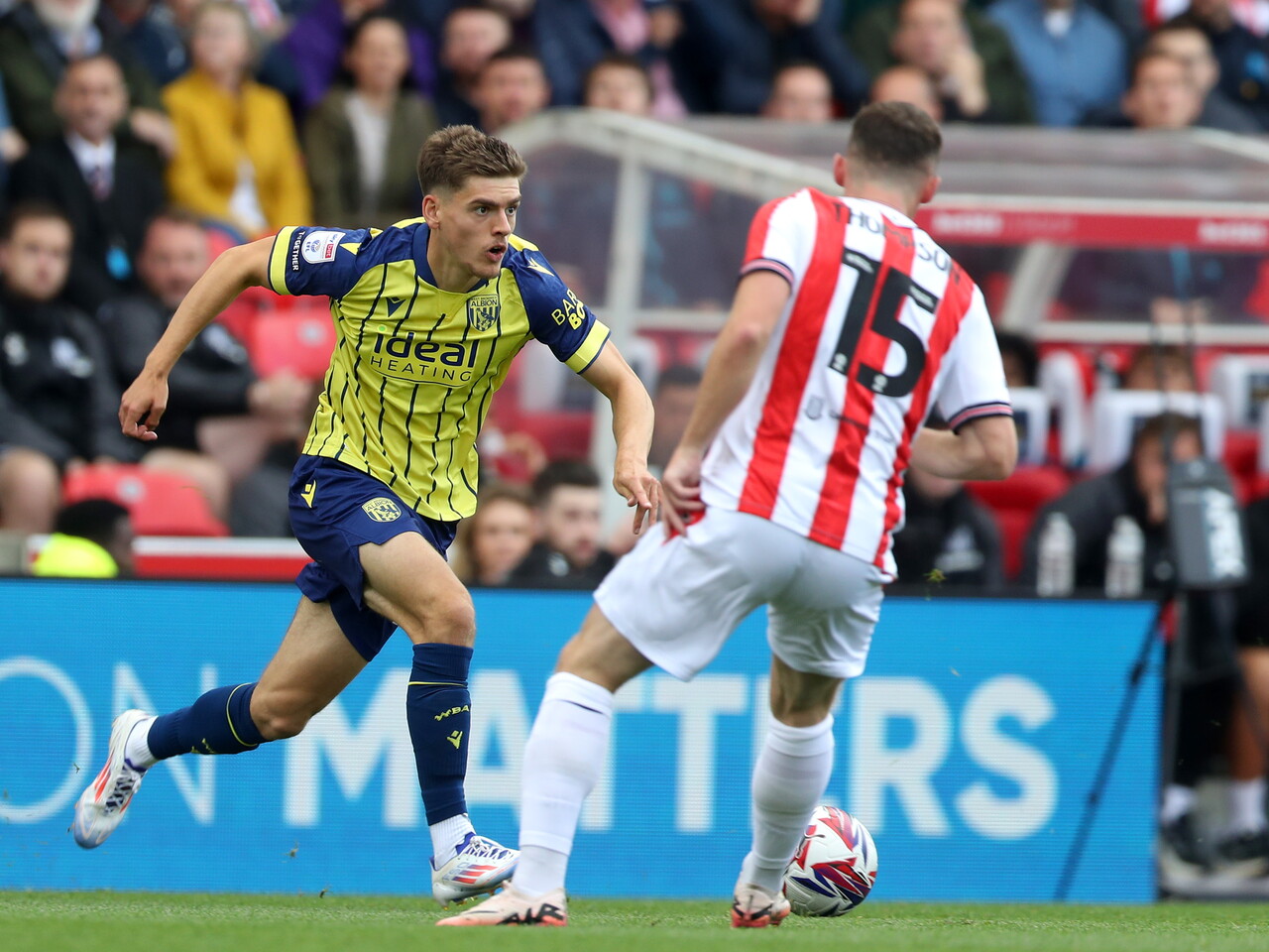 A photo of Albion players in the yellow and blue 2024/25 away kit against Stoke City