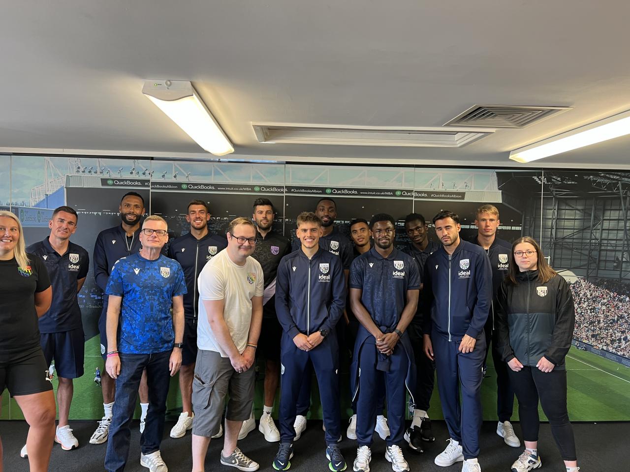 Proud Baggies representatives pose with Albion first team players.