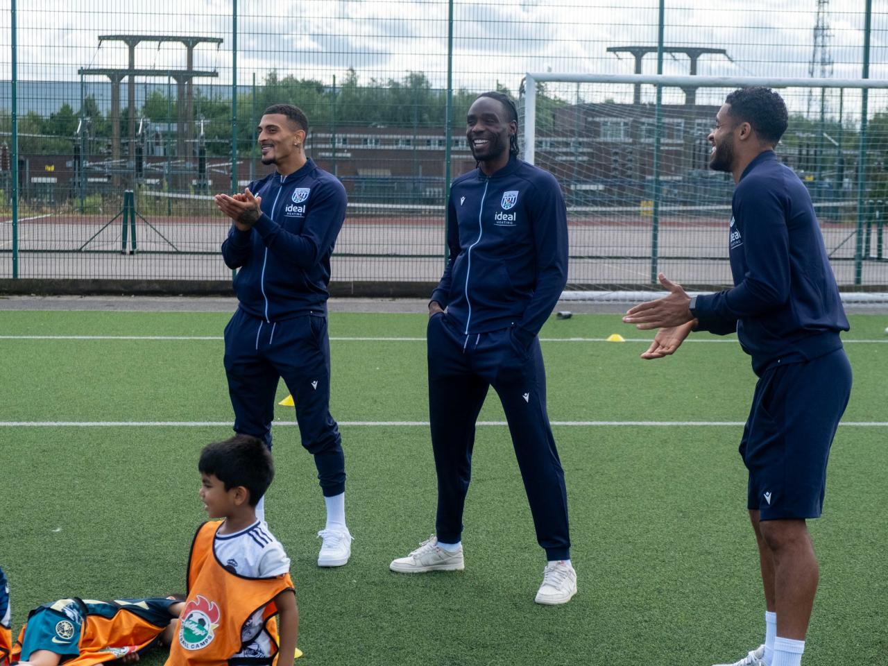 Karlan Grant, Devante Cole and Darnell Furlong answer questions from camp participants.