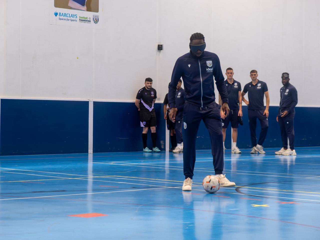Devante Cole takes part in a blind football session.