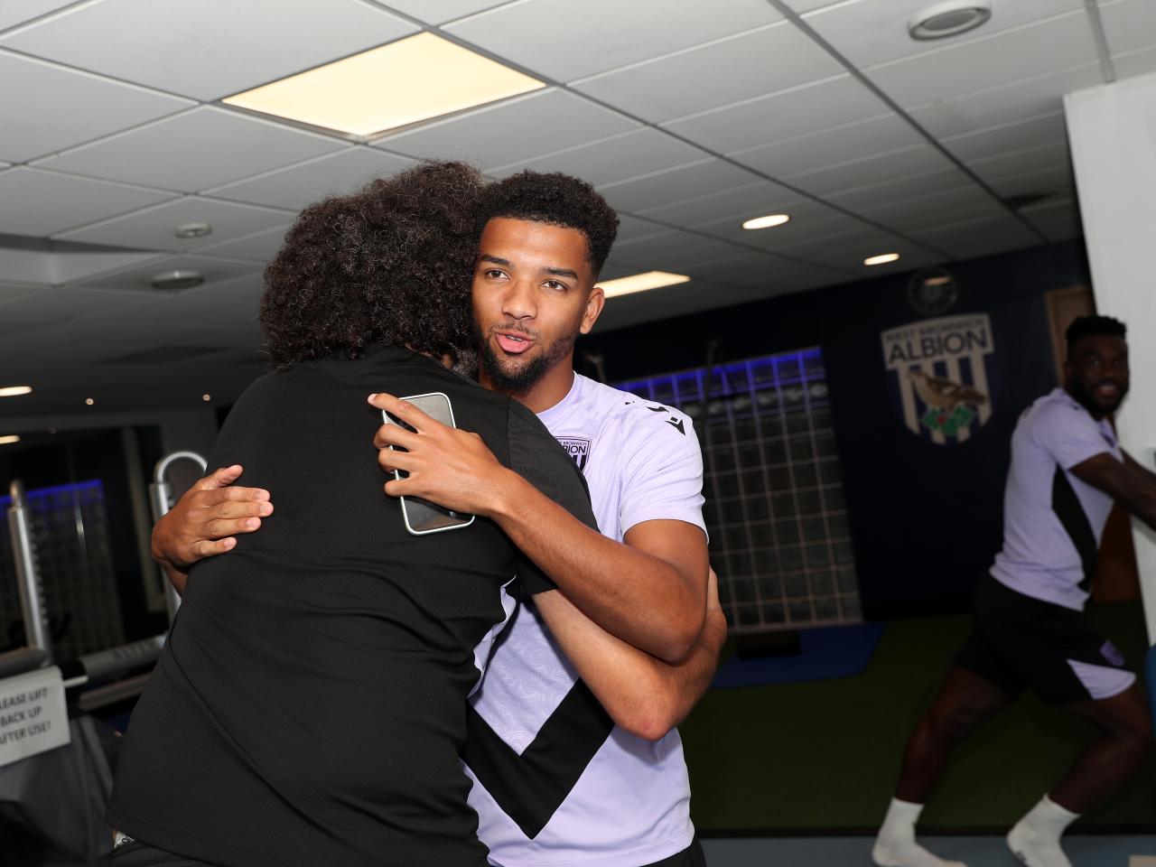 Mason Holgate hugging a member of staff
