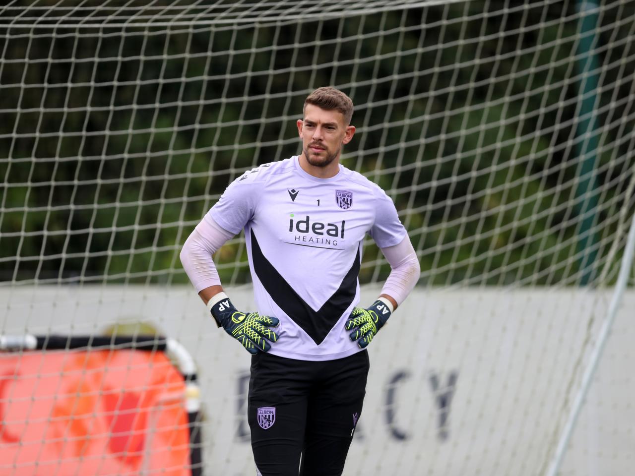 Alex Palmer with his hands on his hips during a training session 