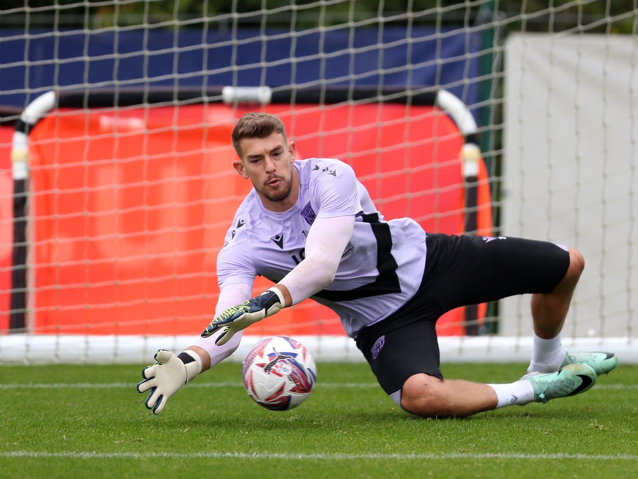 Alex Palmer making a save during a training session