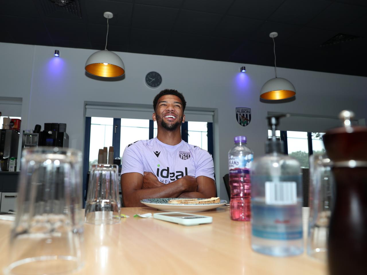 Mason Holgate smiling sat at the table in the canteen