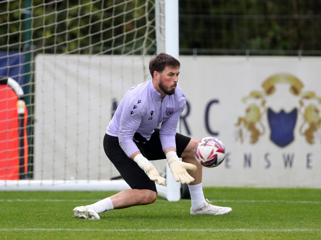 Joe Wildsmith making a save during a training session