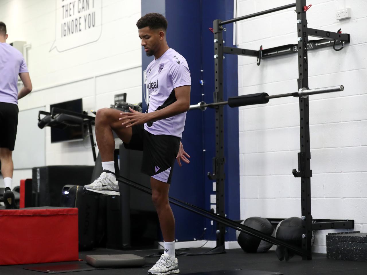 Mason Holgate stretching in the gym