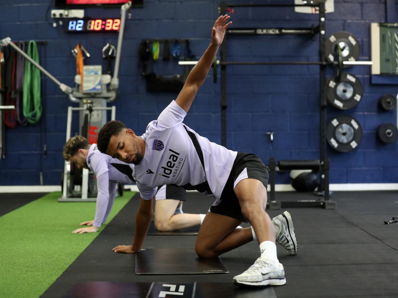 Mason Holgate stretching in the gym