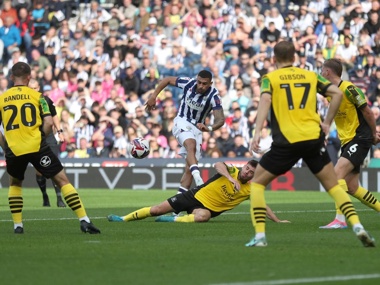 Karlan Grant shoots at goal against Plymouth 