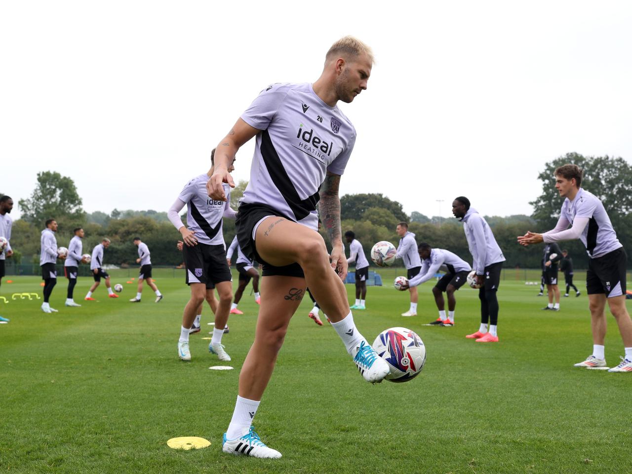 Uroš Račić passing a ball during a training session 