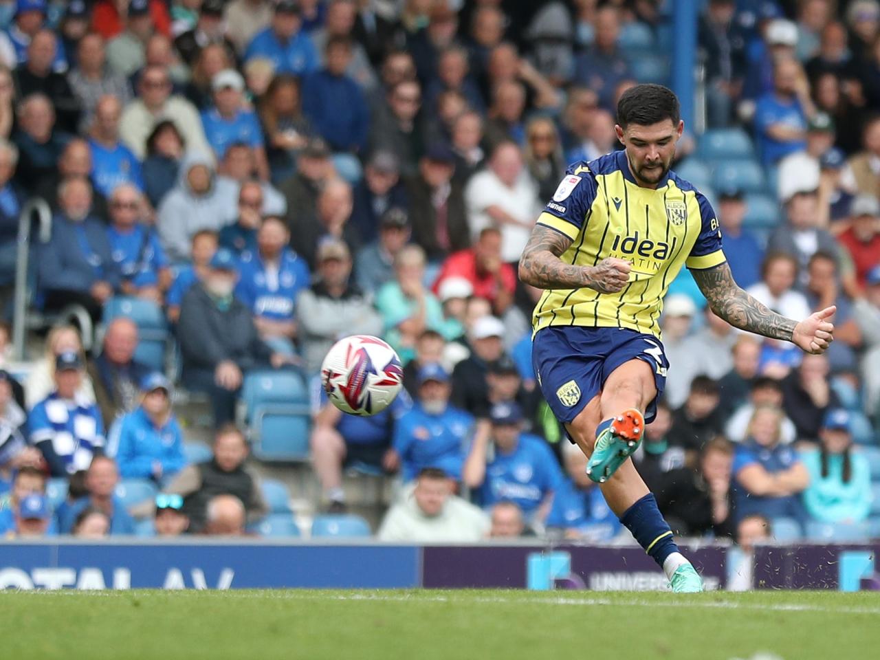 Albion in action against Portsmouth at Fratton Park, in yellow and blue away colours.