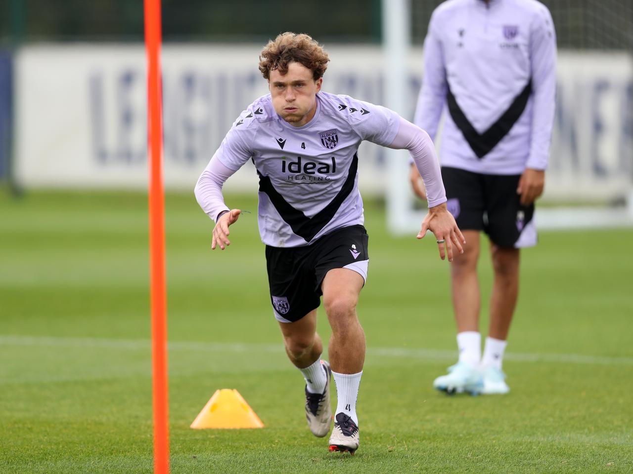 Callum Styles running forwards during a training session 