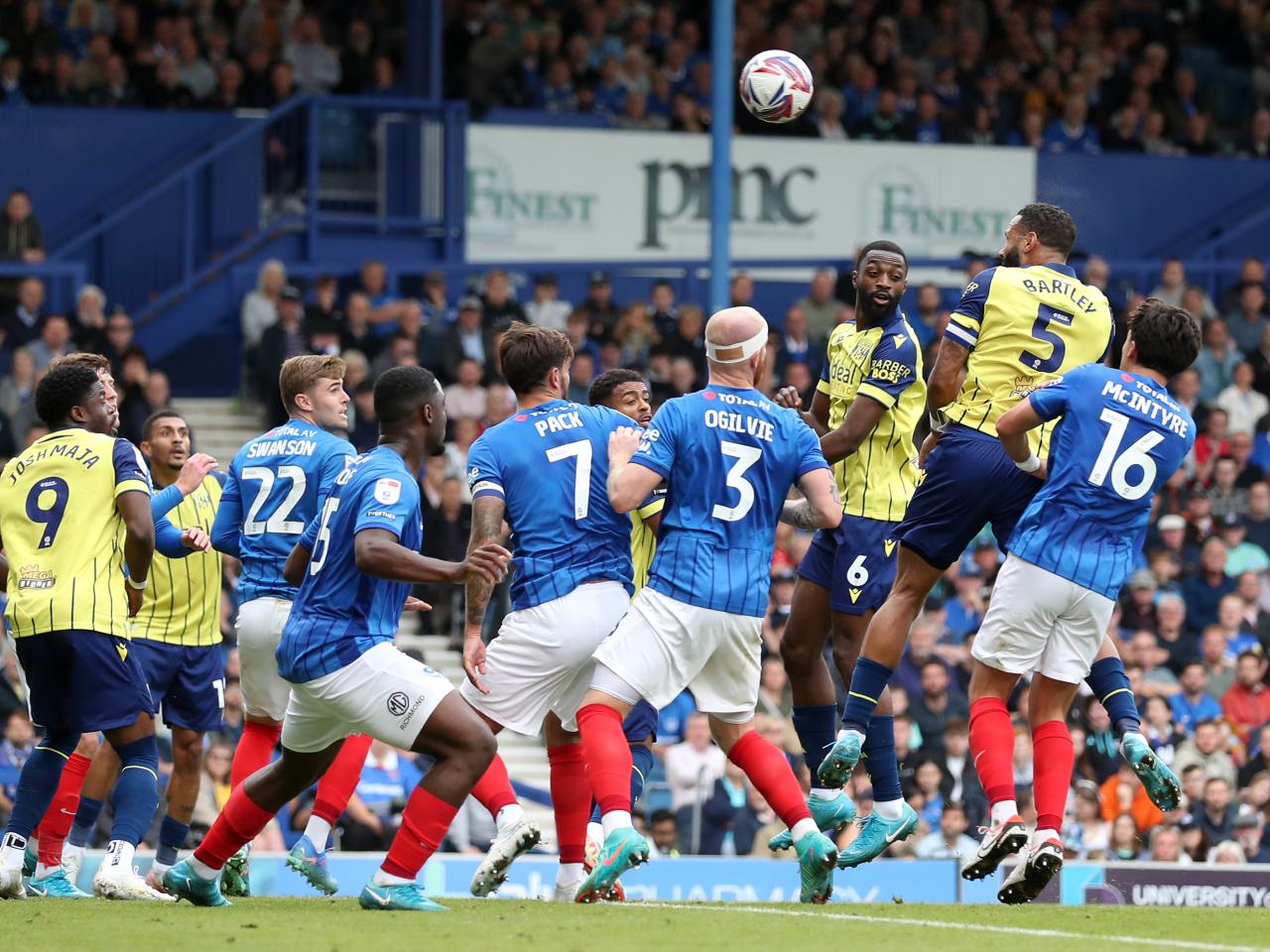 Albion in action against Portsmouth at Fratton Park, in yellow and blue away colours.