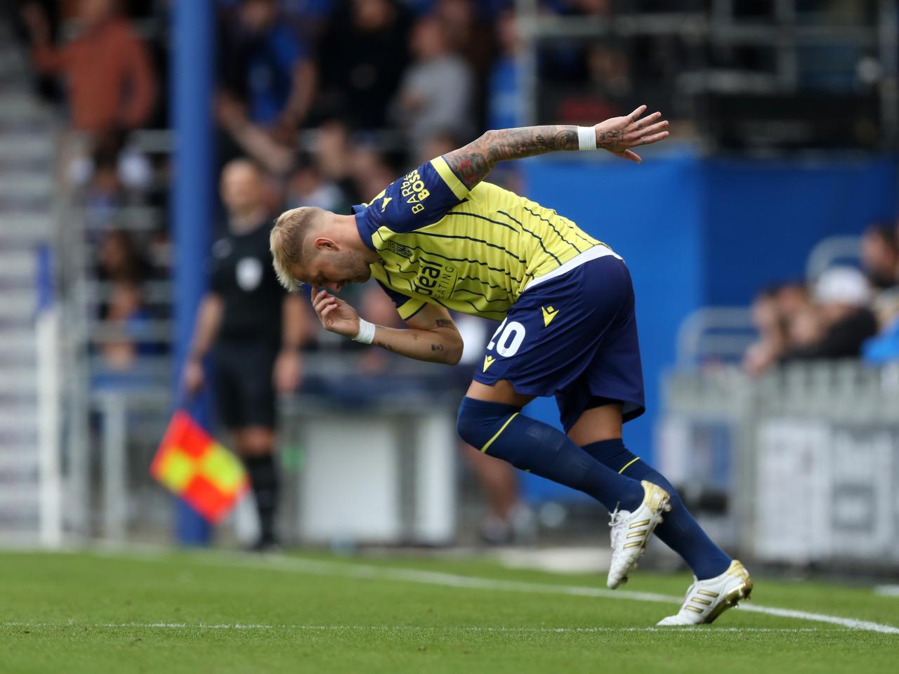 Albion in action against Portsmouth at Fratton Park, in yellow and blue away colours.