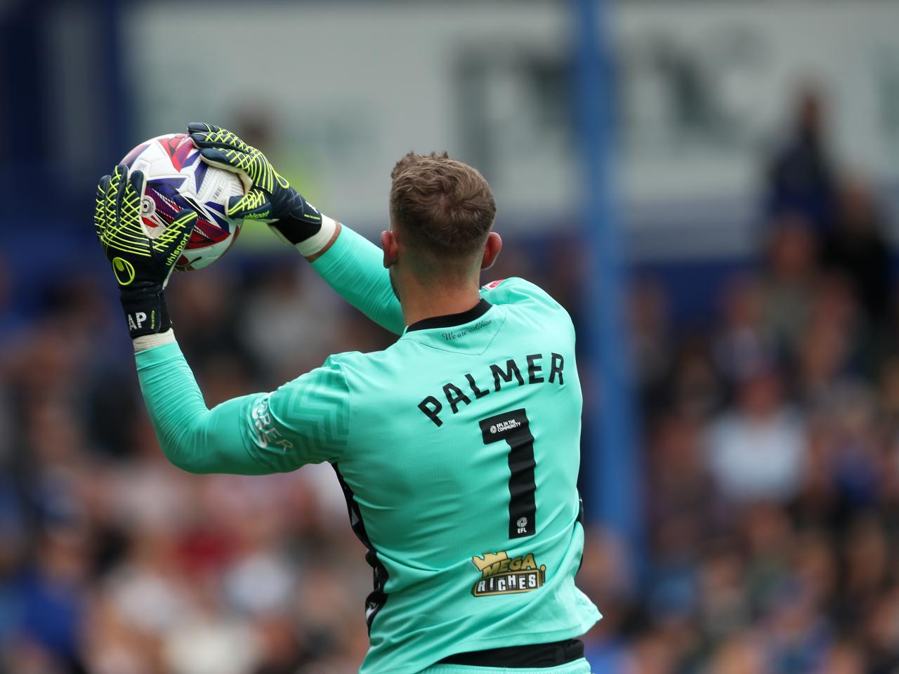 Albion in action against Portsmouth at Fratton Park, in yellow and blue away colours.