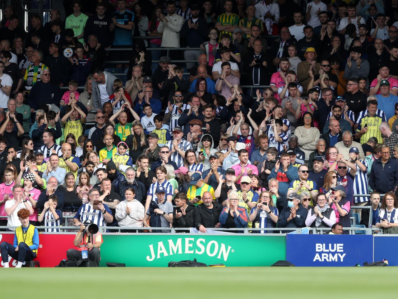 Albion in action against Portsmouth at Fratton Park, in yellow and blue away colours.