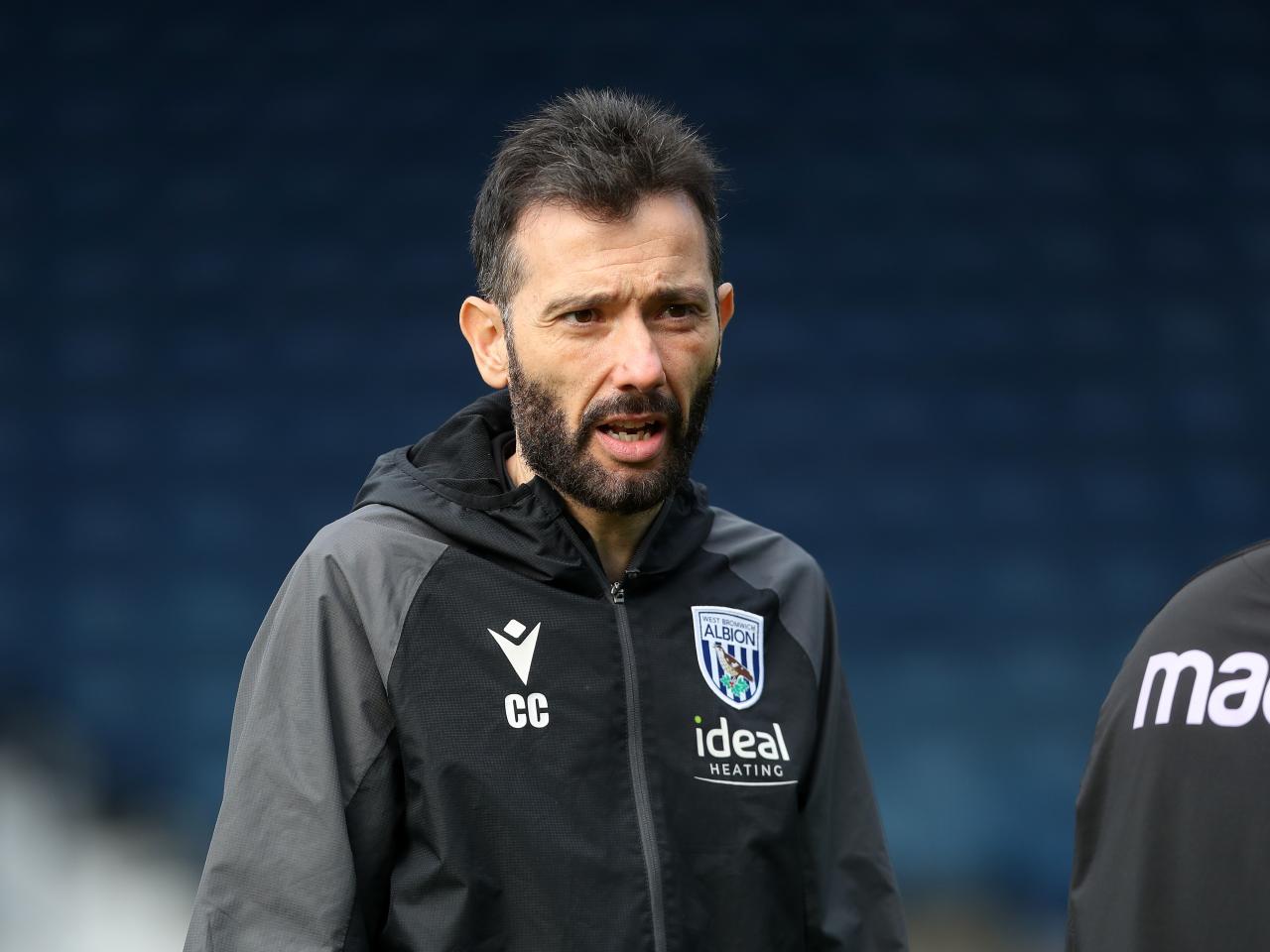 Carlos Corberán watching training at The Hawthorns 