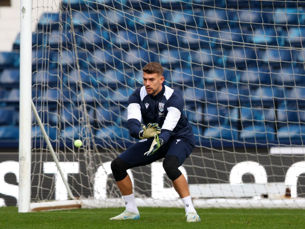 Alex Palmer catching a small ball during a training session at The Hawthorns 