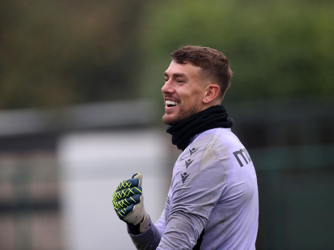 Alex Palmer laughing during a training session 
