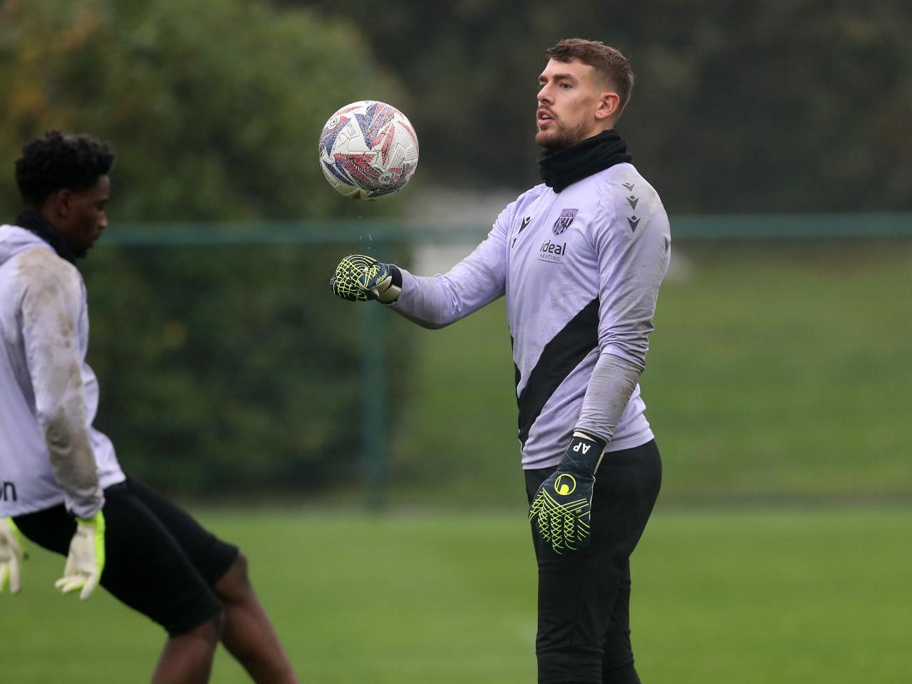 Alex Palmer juggling a ball during a training session