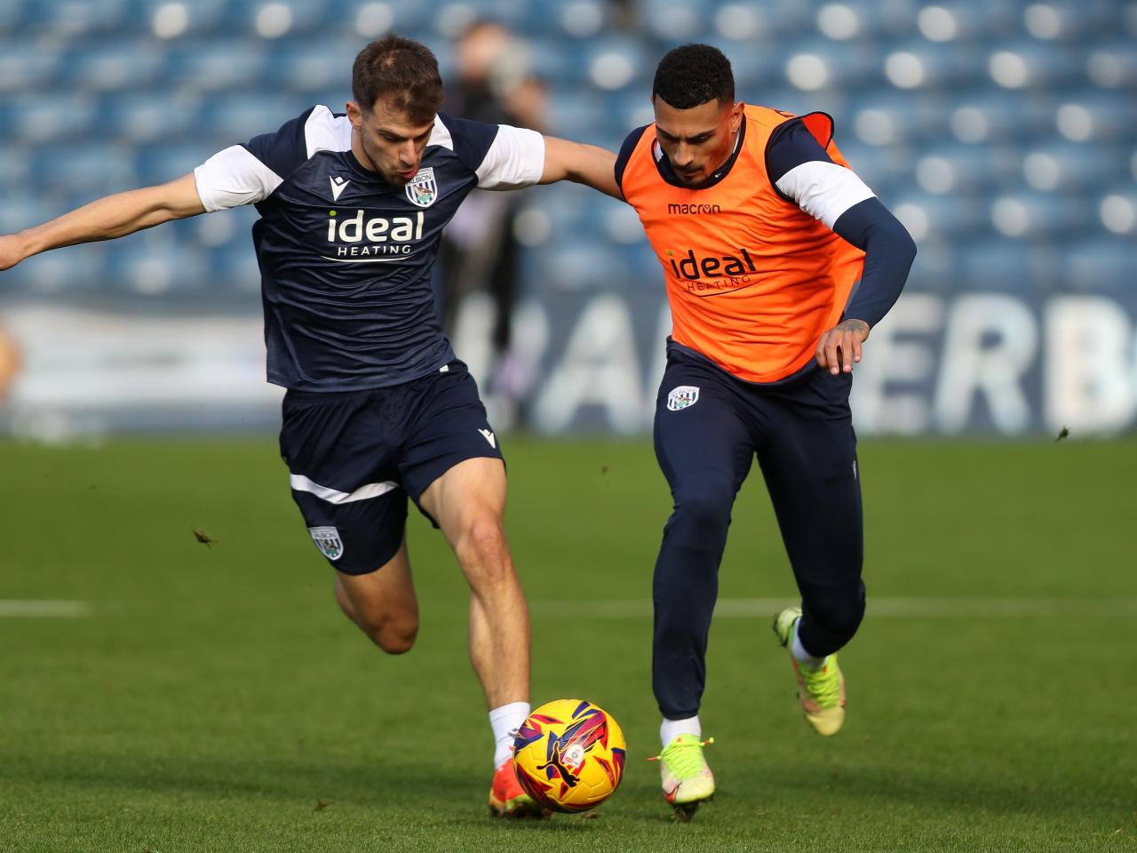 Jayson Molumby and Karlan Grant battle for the ball during a training session at The Hawthorns