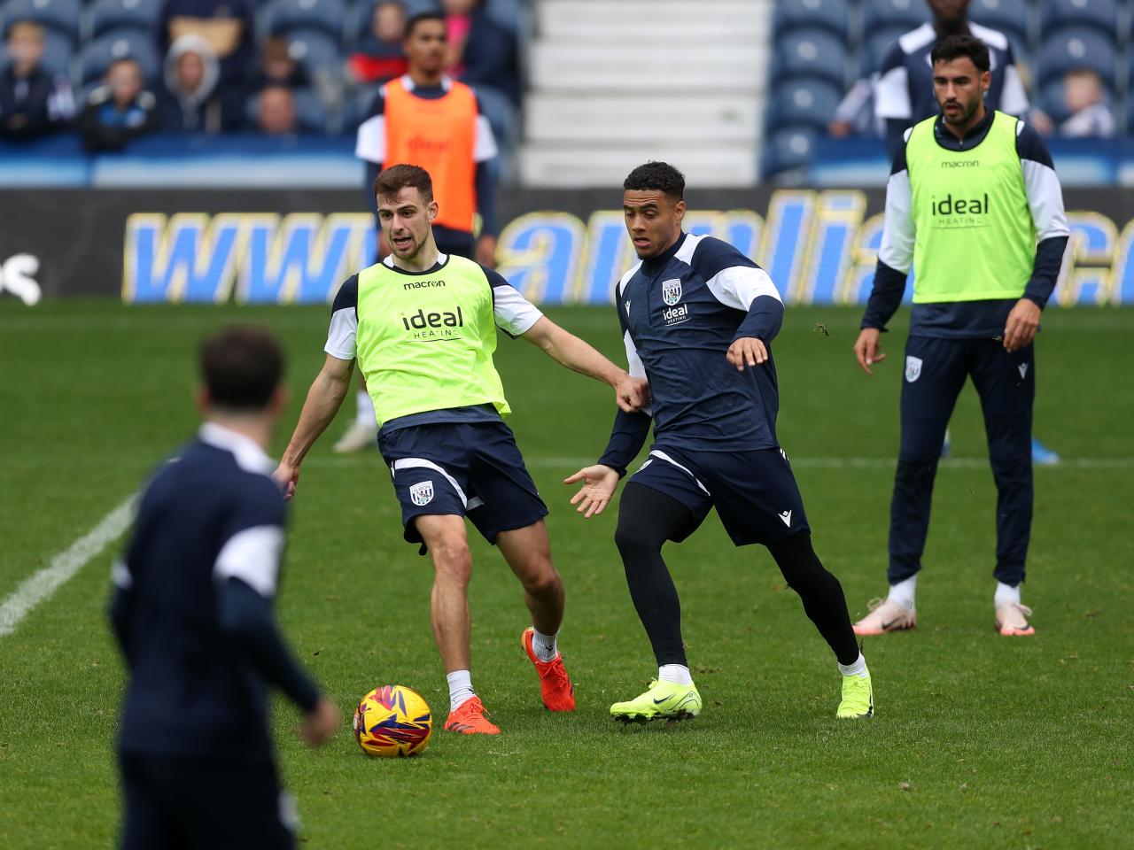 Jayson Molumby and Lewis Dobbin fight for the ball during a training session at The Hawthorns