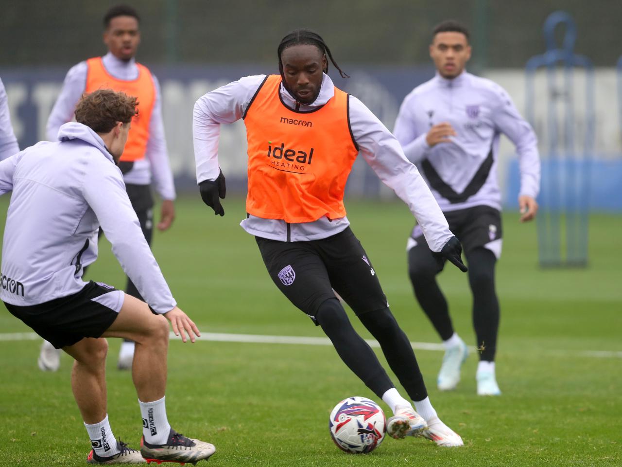 Devante Cole running with the ball during a training session 