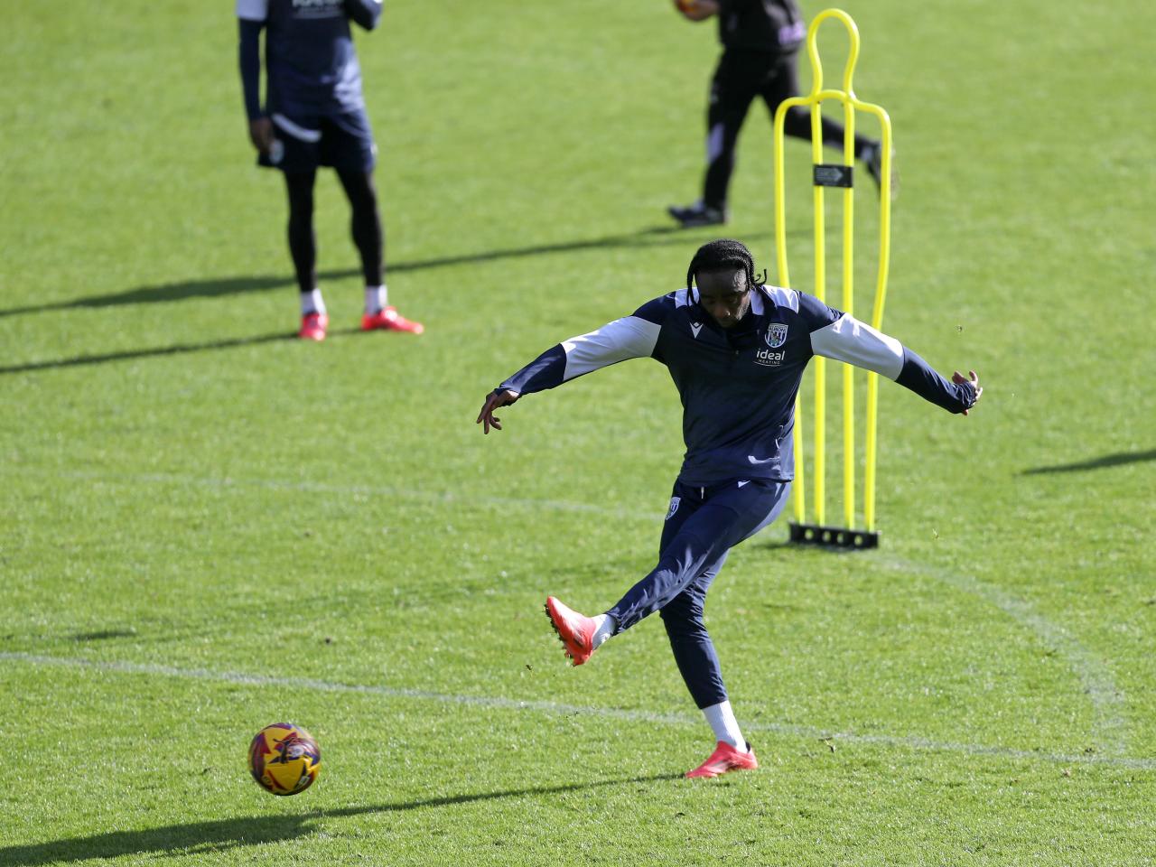 Devante Cole striking the ball during a training session at The Hawthorns