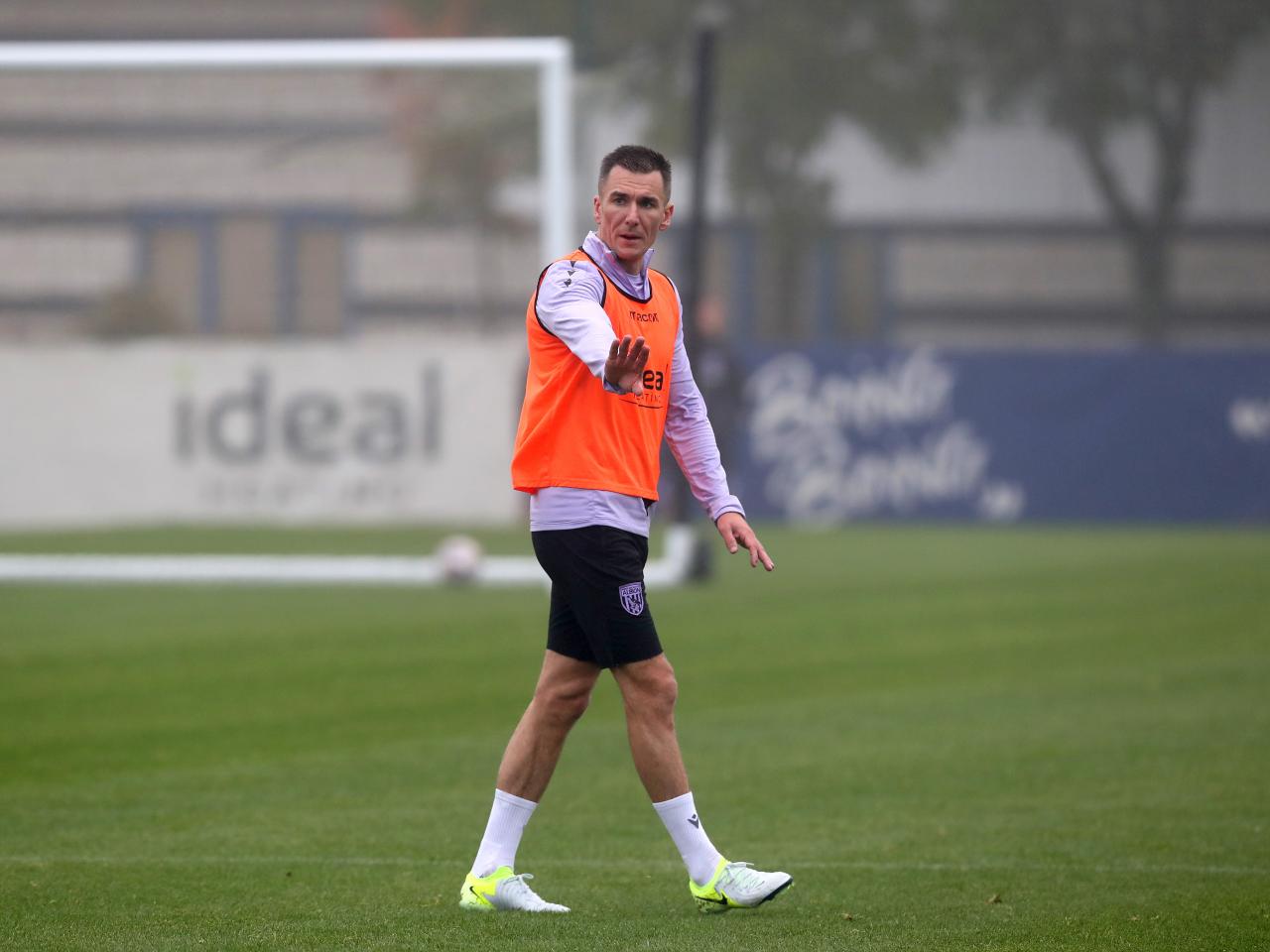 Jed Wallace with his hand outstretched during a training session 