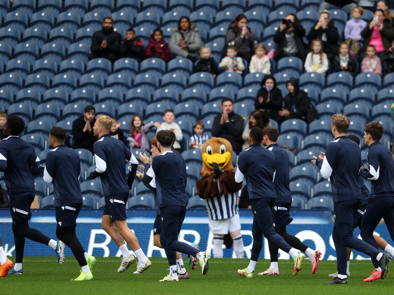 Albion players applaud fans in the stands on open training day