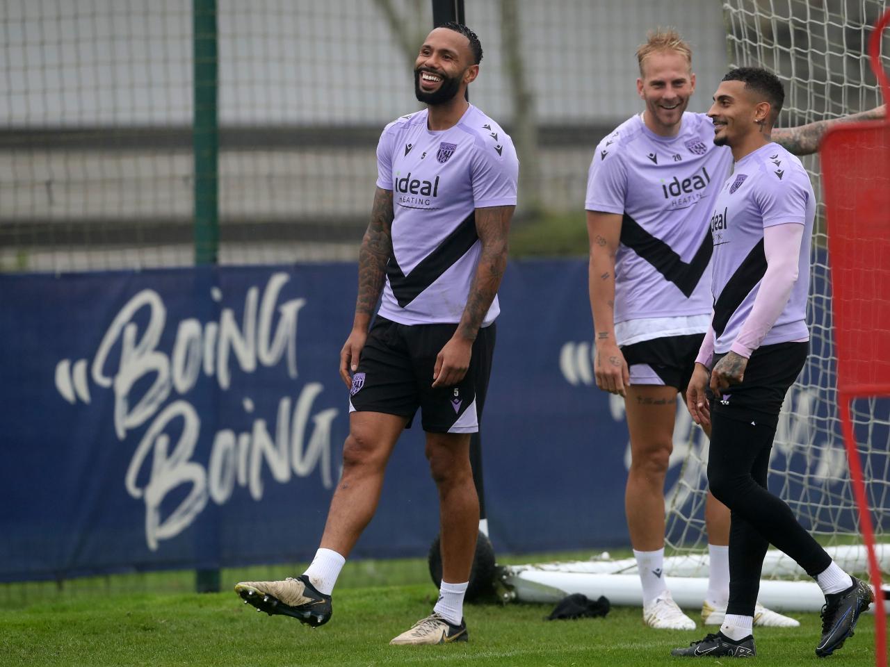 Kyle Bartley, Uroš Račić and Karlan Grant laughing together during a training session 