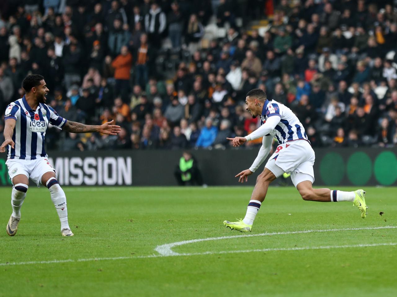 Karlan Grant celebrates scoring against Hull City 