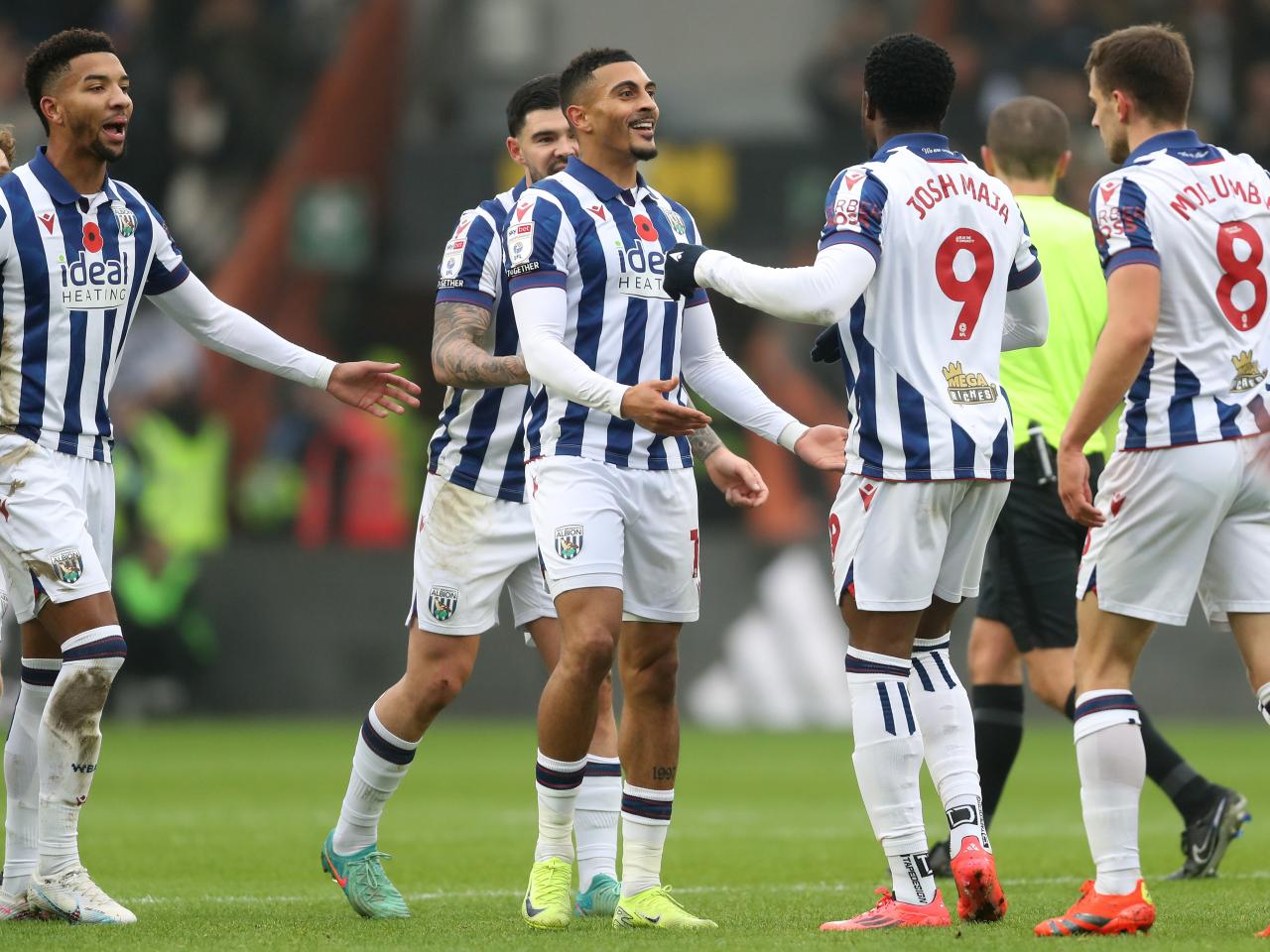 Karlan Grant celebrates scoring against Hull City with team-mates