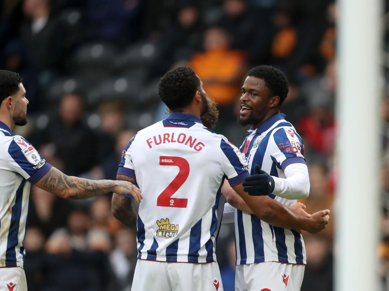 Josh Maja celebrates scoring against Hull with Darnell Furlong