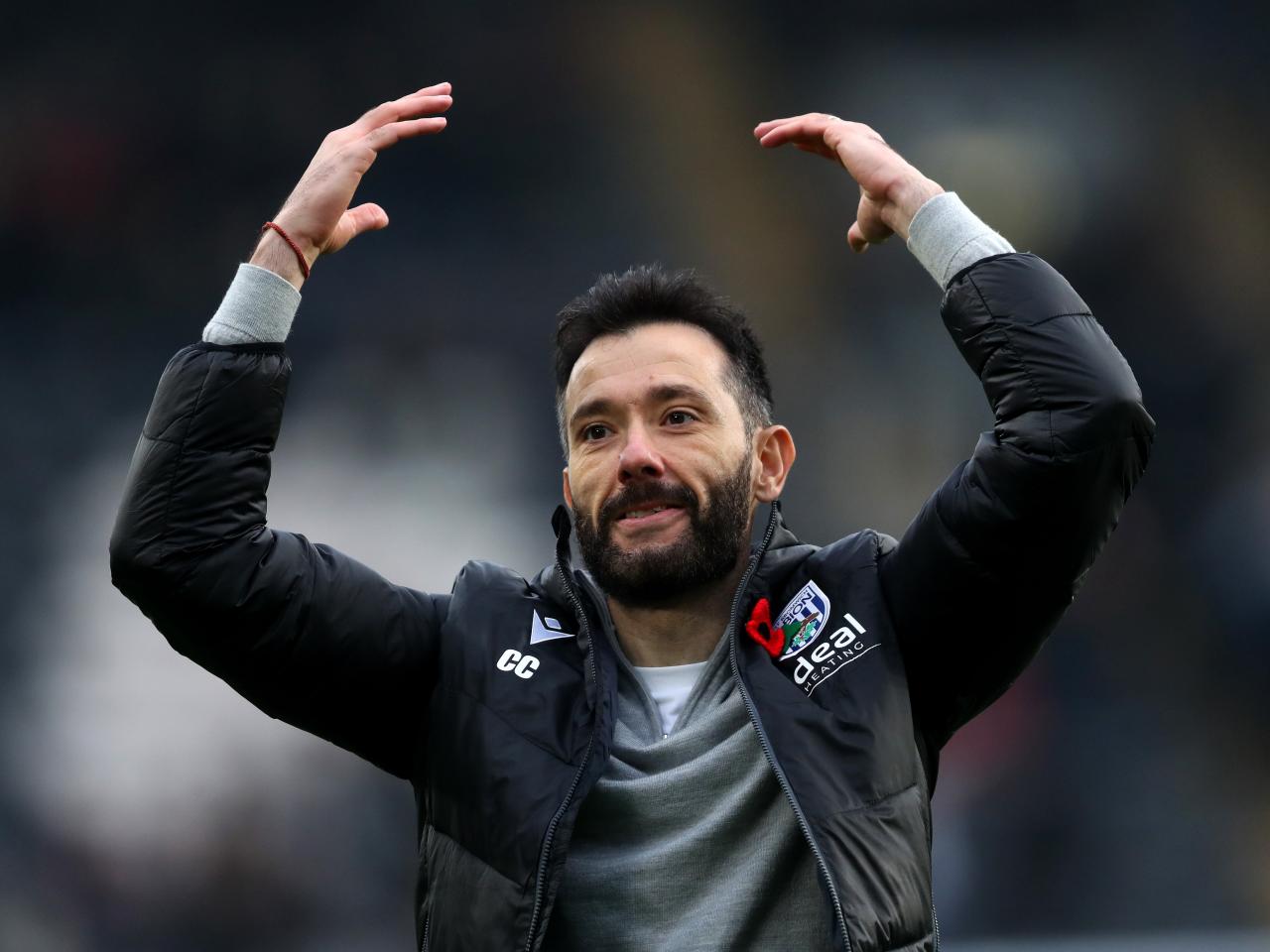 Carlos Corberán celebrates a win after the full-time whistle