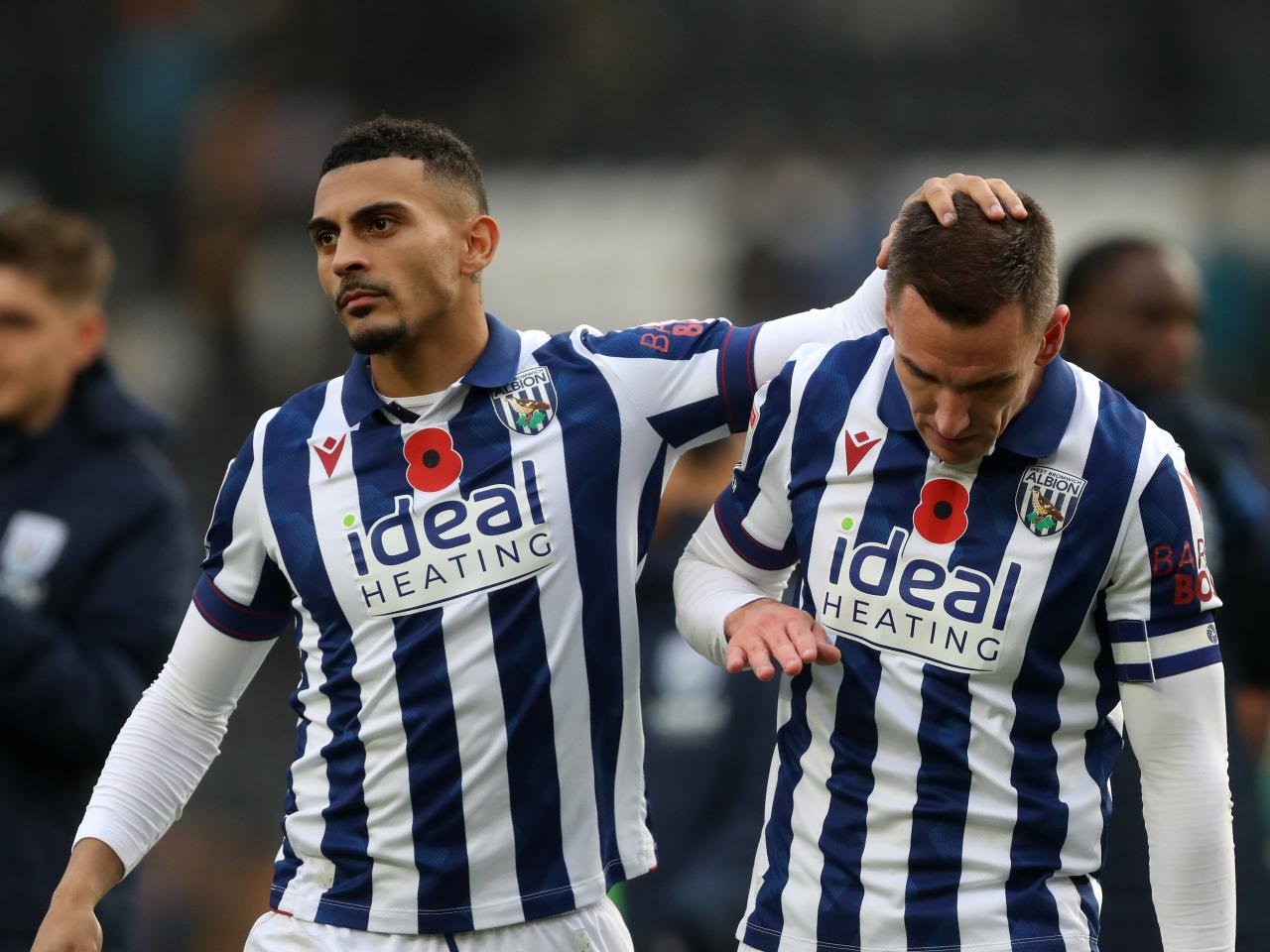 Karlan Grant and Jed Wallace embrace at full-time at Hull