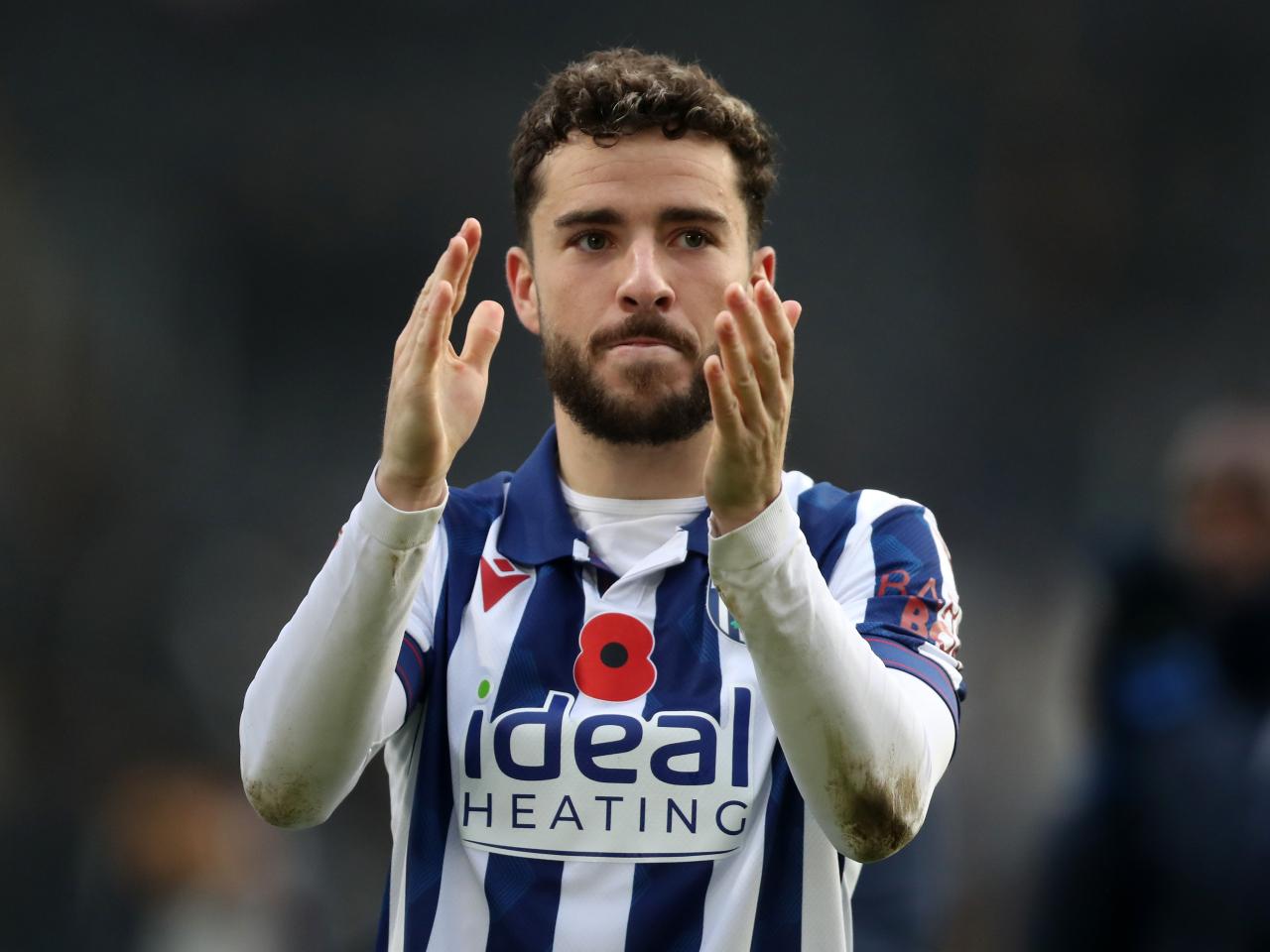 Mikey Johnston applauds Albion fans at full-time at Hull