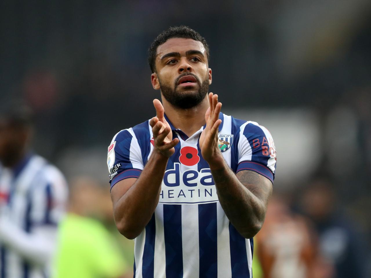 Darnell Furlong applauds Albion fans at full-time at Hull