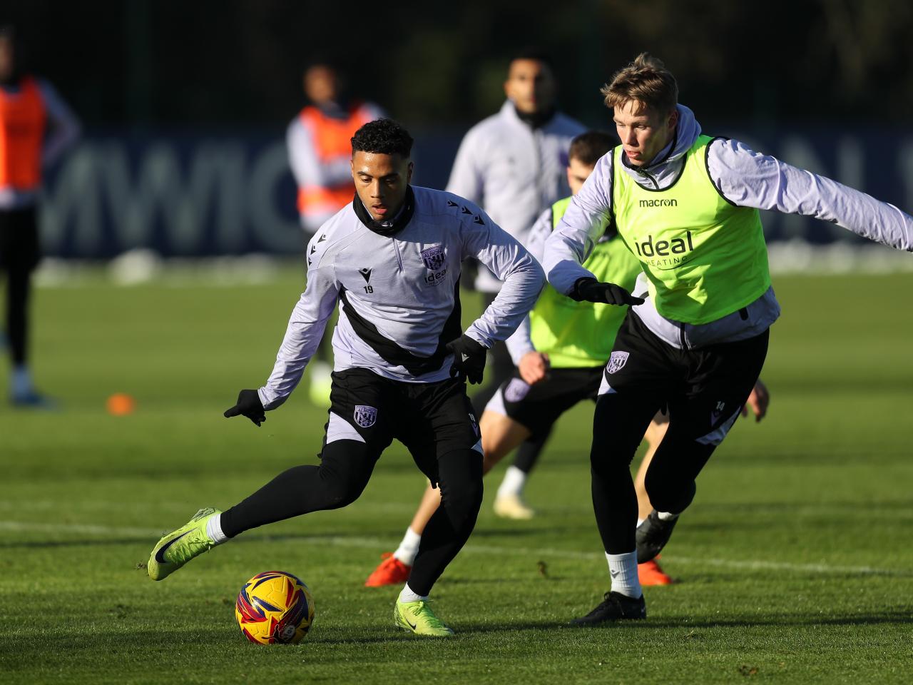 Lewis Dobbin on the ball during training with Torbjørn Heggem close by 