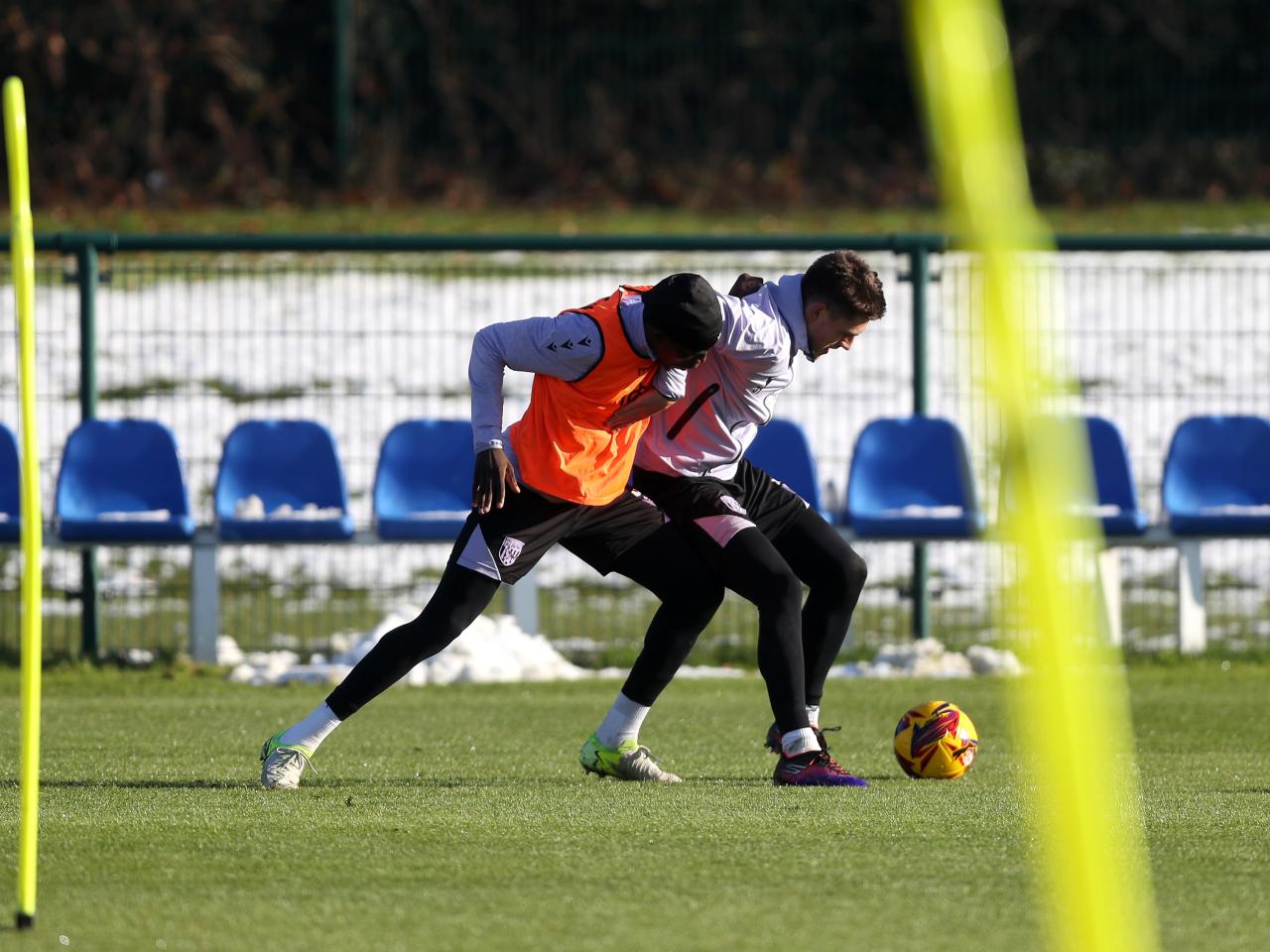 Tom Fellows shielding the ball from a defender during training 