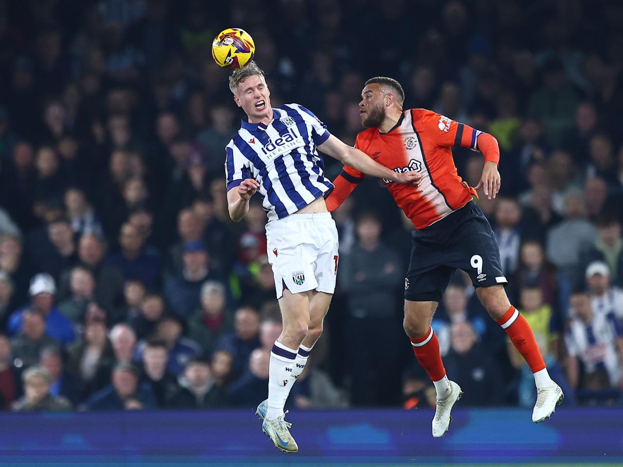 Torbjørn Heggem jumps for a header at Luton Town 