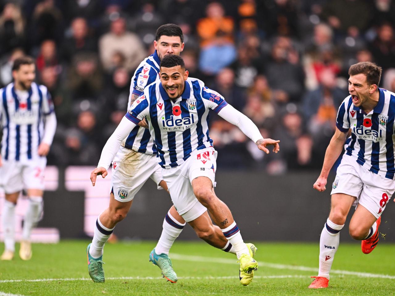 Karlan Grant celebrates scoring against Hull City with team-mates