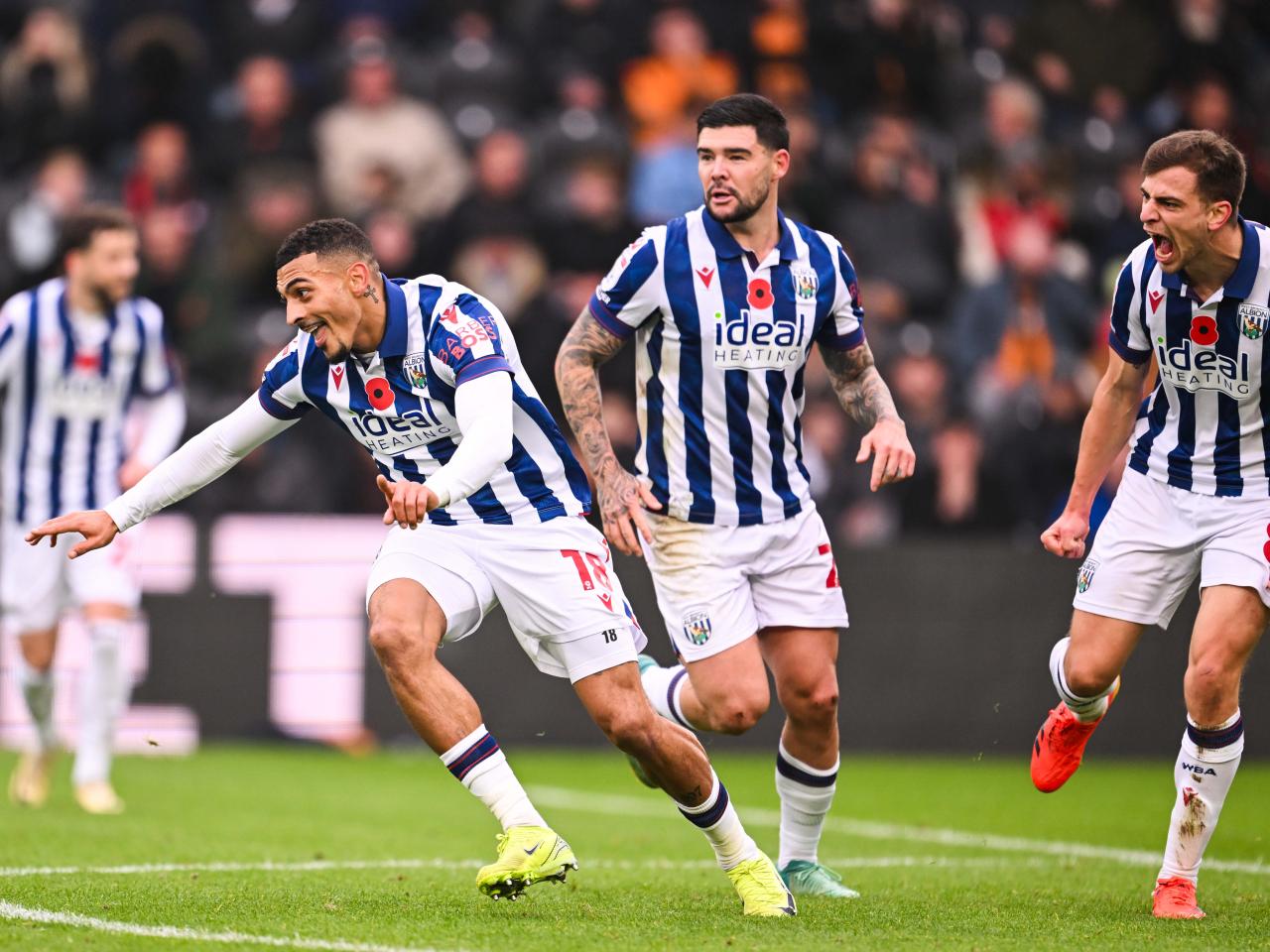 Karlan Grant celebrates scoring against Hull City with team-mates